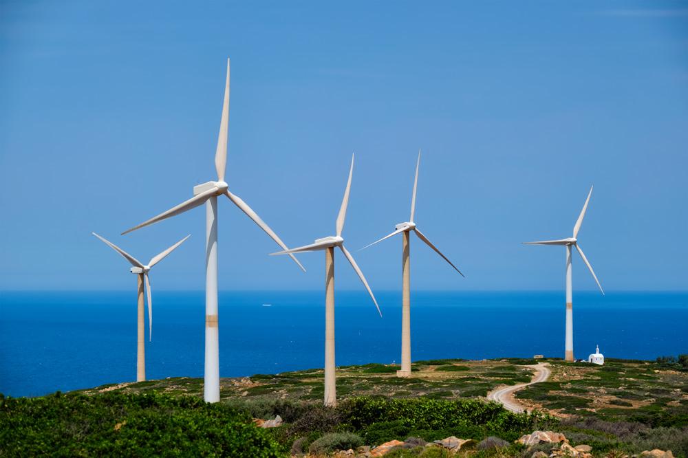 Green renewable alternative energy concept wind generator turbines generating electricity on Crete, Greece